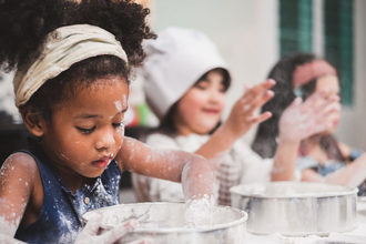 Photo of children playing with flour