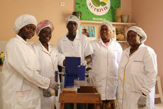 A women’s group in Senegal that uses Bountifield’s Ewing Multi-Crop Grinder to make many of their value-added products, including cookies made from millet and corn. Photo courtesy of Bountifield.